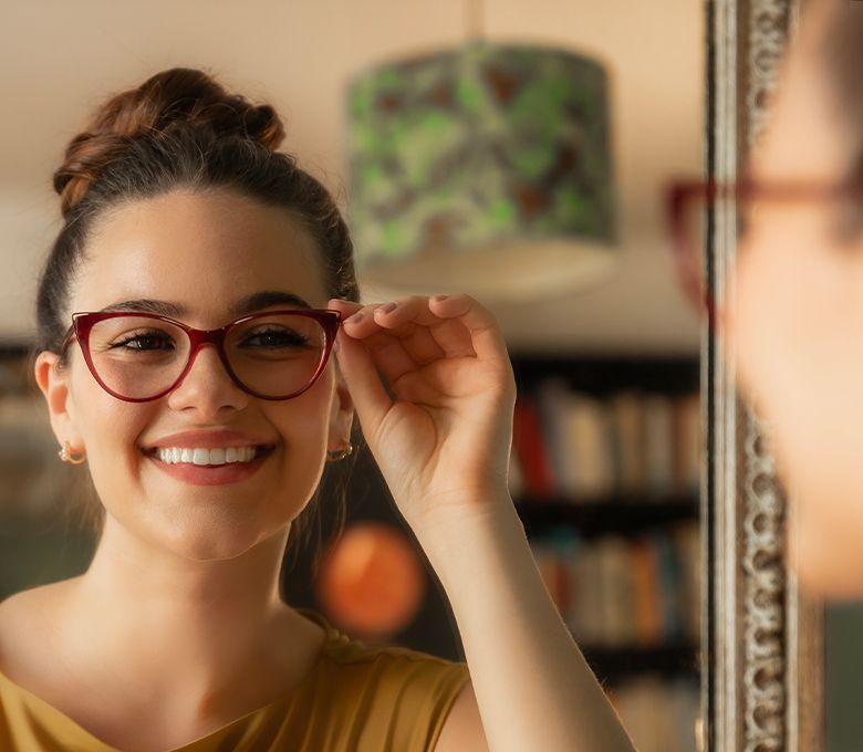 Woman trying on a pair of glasses from her home trial box