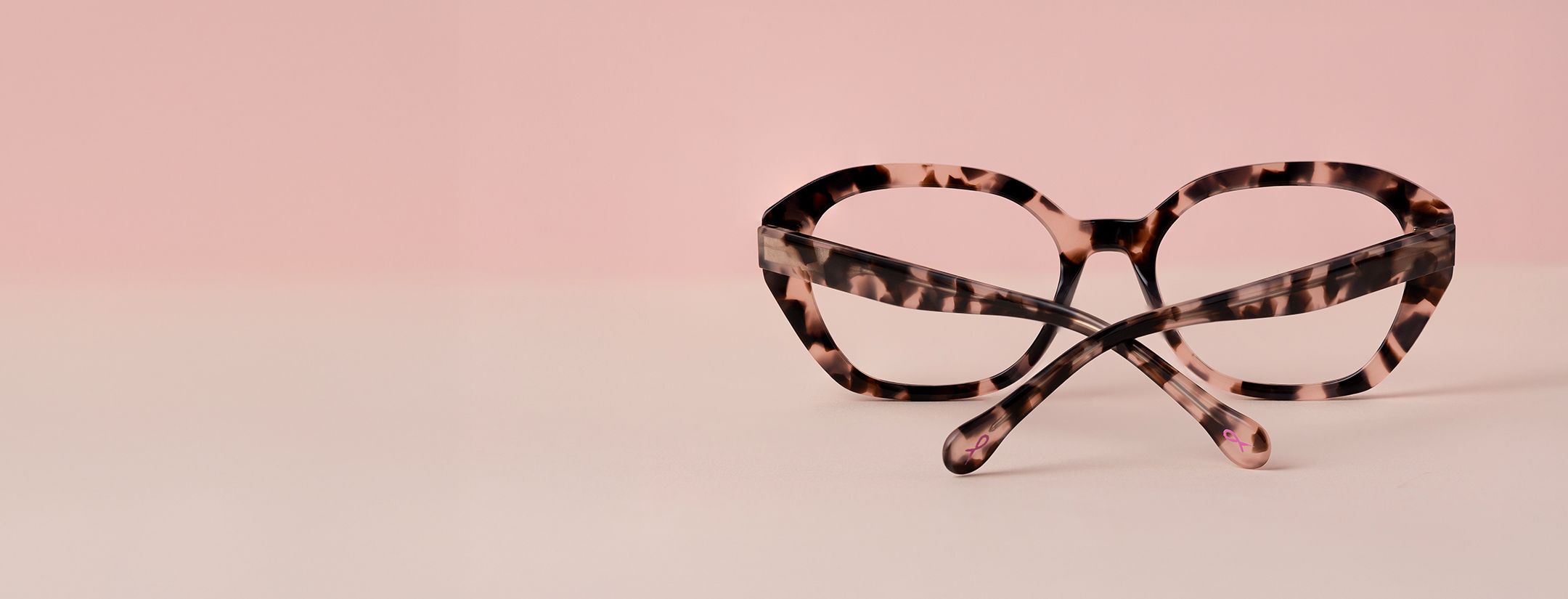 pink ribbon frame facing the opposite way on a pink background